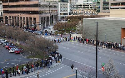 People wait in line for the county-wide Democratic caucus in Boise, Idaho, Tuesday, March 22, 2016. (AP Photo/Otto Kitsinger)