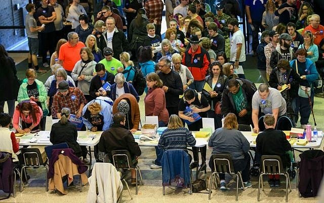 Democrats wait to register to caucus at Bryan High School in Bellevue, Nebraska, Saturday, March 5, 2016. (AP Photo/Nati Harnik)