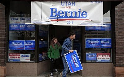 People walk out of a Bernie Sanders campaign office on the day of the Utah Caucus Tuesday, March 22, 2016, in Salt Lake City. (AP Photo/John Locher)