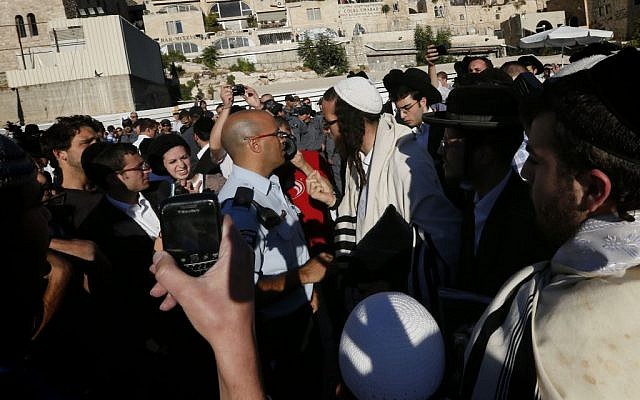 Orthodox Jewish men blow whistles as they try to disturb the monthly prayer service of the Women of the Wall at the Western Wall, August 7, 2013. (Miriam Alster/Flash90) Orthodox Jewish men blow whistles as they try to disturb the monthly prayer service of the Women of the Wall at the Western Wall, August 7, 2013. (Miriam Alster/Flash90)