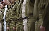 IDF soldiers stand to attention during a ceremony. (Miriam Alster/Flash90)
