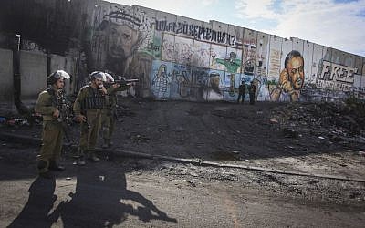 Israeli forces during clashes on November 2, 2014 at the Qalandia checkpoint. (Issam Rimawi/Flash90)