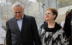 Former president Moshe Katsav, left, serving a seven-year sentence for rape, seen with his wife, Gila, leaving Ma'asiyahu Prison for a furlough over the Jewish holiday of Passover, April 3, 2015. (Flash90)