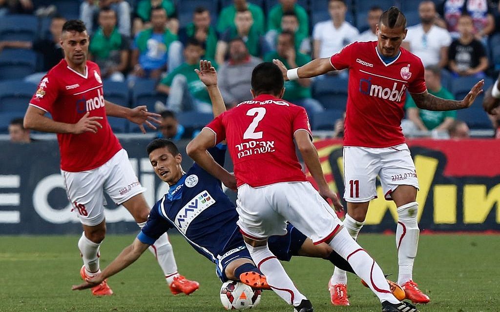 Hapoel Beersheba players (in red) in action against Hapoel Afula during the semifinal of the Israeli cup at the Teddy Stadium in Jerusalem on April 29, 2015. (Yonatan Sindel/Flash90) Hapoel Beersheba players (in red) in action against Hapoel Afula during the semifinal of the Israeli cup at the Teddy Stadium in Jerusalem on April 29, 2015. (Yonatan Sindel/Flash90)