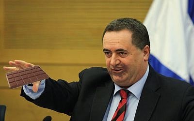 Transportation Minister Yisrael Katz eats a candy bar after reversing his stance on Belgian chocolate on March 23, 2016. (Photo: Issac Harari/Flash90 Editing: Times of Israel staff)