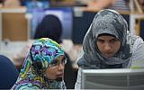 Israeli Bedouin women working at a Bezeq customer service center on July 27, 2015. The call center is located in a mosque, in the Arab town of Hura. The women have been employed through the Rayan employment center in Rahat. (Miriam Alster/Flash90)