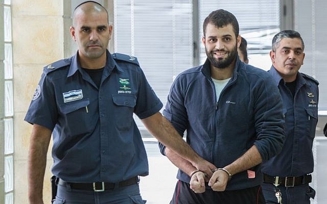 Bilal Abu Ghanem, 21, is escorted by Israeli prison officers outside the Jerusalem District Court on November 9, 2015. (Yonatan Sindel/Flash90) Bilal Abu Ghanem, 21, is escorted by Israeli prison officers outside the Jerusalem District Court on November 9, 2015. (Yonatan Sindel/Flash90)