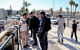 Illustrative: Israeli police officers search a Palestinian man at Damascus Gate in Jerusalem on February 26, 2016. (Haytham Shtayeh/Flash90)