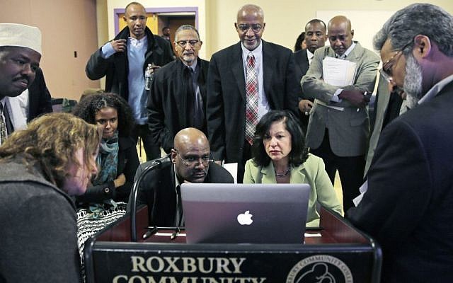 Muslim, Christian, minority and government leaders fix their eyes on a laptop screen showing a video as part of a federal pilot program called 'Countering Violent Extremism,' at Roxbury Community College in Boston, March 31, 2015. (AP/Charles Krupa, File) Muslim, Christian, minority and government leaders fix their eyes on a laptop screen showing a video as part of a federal pilot program called 'Countering Violent Extremism,' at Roxbury Community College in Boston, March 31, 2015. (AP/Charles Krupa, File)