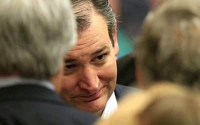 Republican presidential candidate Sen. Ted Cruz, R-Texas, listens to supporters at a caucus site, Saturday, March 5, 2016, in Wichita, Kansas. (AP Photo/Orlin Wagner)