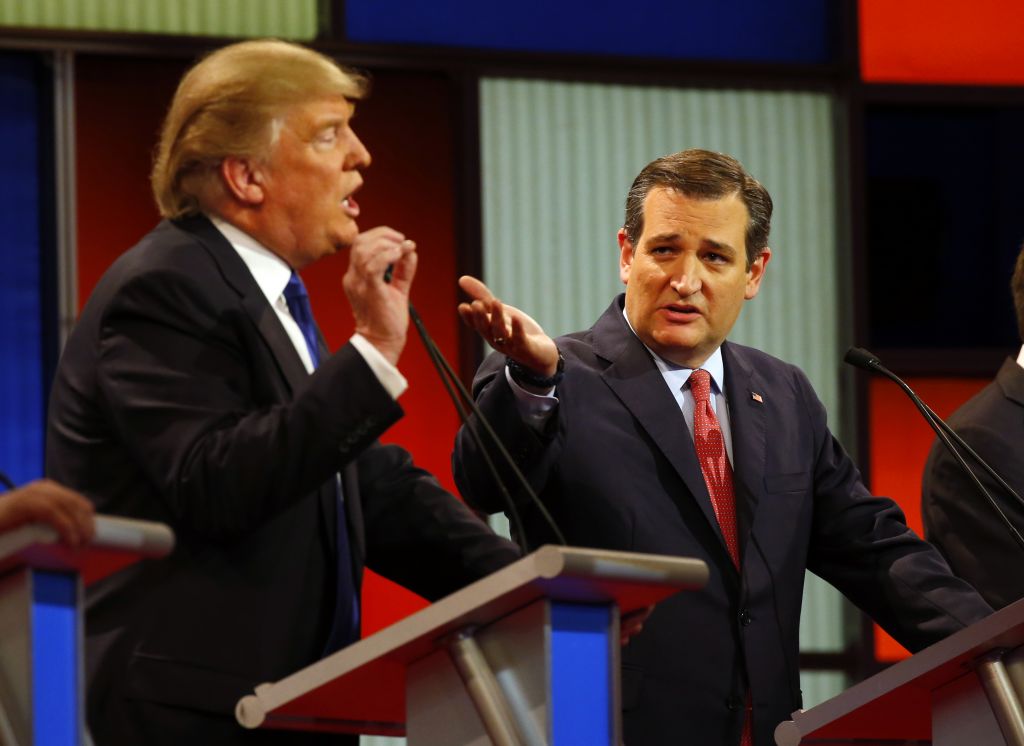Republican presidential candidates, businessman Donald Trump and Sen. Ted Cruz, R-Texas, argue a point during a Republican presidential primary debate at Fox Theatre, Thursday, March 3, 2016, in Detroit. (AP Photo/Paul Sancya)