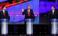 Republican presidential candidate Donald Trump, center, speaks as candidates Sen. Marco Rubio, R-Florida, left, and Sen. Ted Cruz, R-Texas, right, listen, during the Republican presidential debate sponsored by CNN, Salem Media Group and the Washington Times at the University of Miami in Coral Gables, Florida, Thursday, March 10, 2016. (AP Photo/Wilfredo Lee)