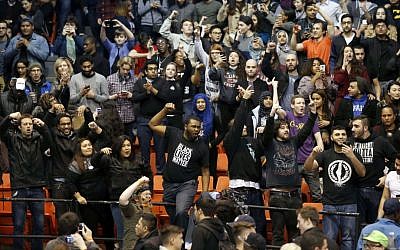 Protesters against Republican presidential candidate Donald Trump chant after it was announced that a rally for Trump was canceled due to security concerns, on the campus of the University of Illinois-Chicago, Friday, March 11, 2016. (AP Photo/Charles Rex Arbogast)