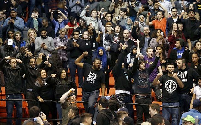 Protesters against Republican presidential candidate Donald Trump chant after it was announced that a rally for Trump was canceled due to security concerns, on the campus of the University of Illinois-Chicago, Friday, March 11, 2016. (AP Photo/Charles Rex Arbogast) Protesters against Republican presidential candidate Donald Trump chant after it was announced that a rally for Trump was canceled due to security concerns, on the campus of the University of Illinois-Chicago, Friday, March 11, 2016. (AP Photo/Charles Rex Arbogast)