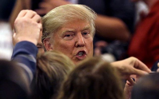 Republican presidential candidate Donald Trump talks to supporters as he leaves a campaign stop in Appleton, Wisconsin, March 30, 2016. (AP Photo/Nam Y. Huh) Republican presidential candidate Donald Trump talks to supporters as he leaves a campaign stop in Appleton, Wisconsin, March 30, 2016. (AP Photo/Nam Y. Huh)