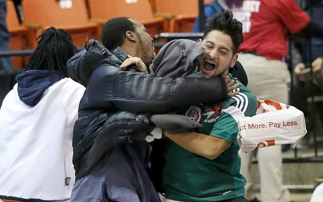 Protesters against Republican presidential candidate Donald Trump celebrate after it was announced that a rally for Trump was canceled due to security concerns on the campus of the University of Illinois-Chicago, Friday, March 11, 2016. (AP Photo/Charles Rex Arbogast) Protesters against Republican presidential candidate Donald Trump celebrate after it was announced that a rally for Trump was canceled due to security concerns on the campus of the University of Illinois-Chicago, Friday, March 11, 2016. (AP Photo/Charles Rex Arbogast)