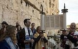 In this photo taken Thursday, Feb. 25, 2016, American Reform Rabbi Zachary Shapiro, center left, and other American and Israeli Reform rabbis pray at the Western Wall. (AP Photo/Sebastian Scheiner)
