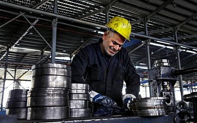 In this Thursday, Feb. 25, 2016 photo, a worker handles steel products at a factory for tubes and pipes in the Muwaqer Industrial Estate, in northern Jordan. The estate is one of five zones in Jordan that would benefit from proposed new trade terms with Europe, part of a precedent-setting plan by Jordan and international donors to put up to 200,000 Syrian refugees in coming years. (AP Photo/Raad Adayleh) In this Thursday, Feb. 25, 2016 photo, a worker handles steel products at a factory for tubes and pipes in the Muwaqer Industrial Estate, in northern Jordan. The estate is one of five zones in Jordan that would benefit from proposed new trade terms with Europe, part of a precedent-setting plan by Jordan and international donors to put up to 200,000 Syrian refugees in coming years. (AP Photo/Raad Adayleh)