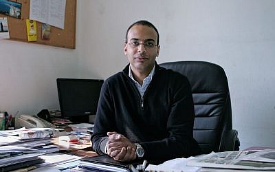 Investigative journalist Hossam Bahgat in his office at the Egyptian Initiative for Personal Rights in Garden City, Cairo, Egypt, December 7, 2011. (Sarah Rafea via AP, File)