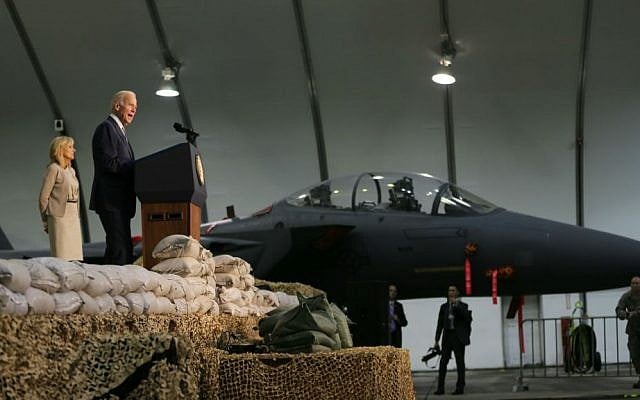 US Vice President Joe Biden talks to American and allied soldiers next to his wife Dr. Jill Biden at a military base in United Arab Emirates, Monday, March 7, 2016. (AP Photo/Kamran Jebreili)
