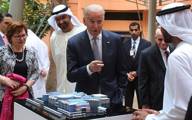 Joe Biden, the U.S. Vice President, points to one of the Masdar City employees as Sultan Ahmed Al Jaber, UAE minister of state and the chairman of Masdar City, 3rd left, looks on, in Abu Dhabi, United Arab Emirates, Monday, March 7, 2016. (AP Photo/Kamran Jebreili)