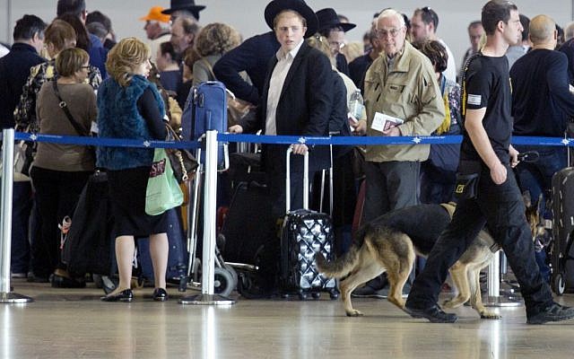 An Israeli airport security guard patrols with a dog in Ben Gurion airport near Tel Aviv, Israel, Tuesday, March 22, 2016. (AP Photo/Ariel Schalit) An Israeli airport security guard patrols with a dog in Ben Gurion airport near Tel Aviv, Israel, Tuesday, March 22, 2016. (AP Photo/Ariel Schalit)