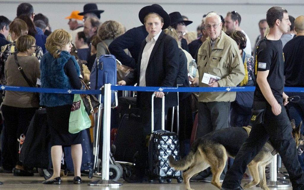 An Israeli airport security guard patrols with a dog in Ben Gurion airport near Tel Aviv, Israel, Tuesday, March 22, 2016. (AP Photo/Ariel Schalit) An Israeli airport security guard patrols with a dog in Ben Gurion airport near Tel Aviv, Israel, Tuesday, March 22, 2016. (AP Photo/Ariel Schalit)