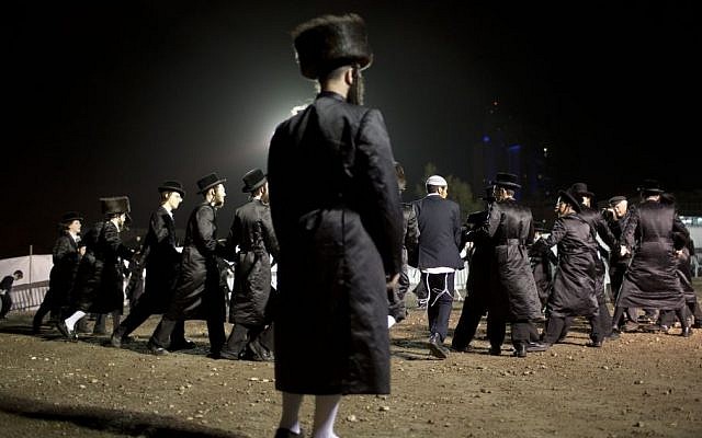 Ultra-Orthodox Jews dance in the men's section during the wedding of the grandson of the Rabbi of the Tzanz Hasidic dynasty community, in Netanya, Israel, Tuesday, March 15, 2016. (AP Photo/Oded Balilty)
