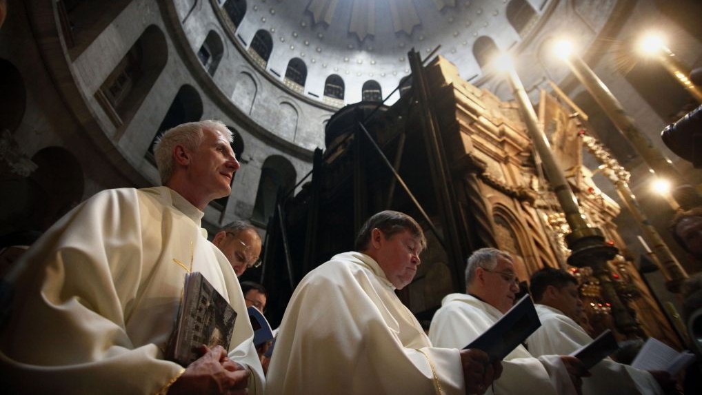 Christian clergymen stand during the Washing of the Feet ceremony at the Church of the Holy Sepulchre, traditionally believed by many to be the site of the crucifixion and burial of Jesus Christ, in Jerusalem's Old City, Thursday, March 24, 2016. (Mahmoud Illean/AP) Christian clergymen stand during the Washing of the Feet ceremony at the Church of the Holy Sepulchre, traditionally believed by many to be the site of the crucifixion and burial of Jesus Christ, in Jerusalem's Old City, Thursday, March 24, 2016. (Mahmoud Illean/AP)