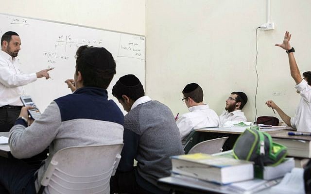 In this photo taken Tuesday, March 15, 2016, a teacher asks a question during a class at the Yeshiva high school Chachme Lev in Jerusalem. (AP Photo/Dan Balilty)