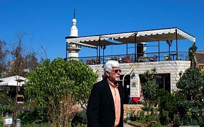 In this picture taken Monday, Feb. 29, 2016, Thomas Webber, 71, walks in garden next to the Citadel of Damascus, Syria. (AP Photo/Hassan Ammar)
