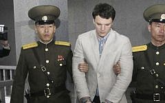 American student Otto Warmbier, center, is escorted at the Supreme Court in Pyongyang, North Korea, March 16, 2016. (AP/Jon Chol Jin)