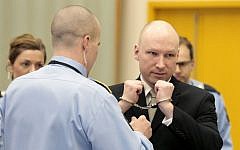 Anders Behring Breivik has his handcuffs removed inside a court room at Skien prison in Skien, Norway, Wednesday, March 16, 2016. (Lise Aserud/NTB scanpix via AP)