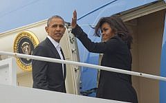 US President Barack Obama, left, and firsl Lady Michelle Obama board Air Force One, Sunday, March 20, 2016, at Andrews Air Force Base, Md. (AP Photo/Pablo Martinez Monsivais)
