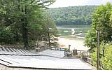The waterfront at Camp Ramah in the Berkshires includes a wide variety of inflatable toys and surf kayaks. (Uriel Heilman/JTA)