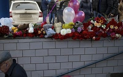 Flowers, children's toys and balloons are seen outside a subway station in Moscow, Russia, on Tuesday, March 1, 2016. (AP Photo/Ivan Sekretarev) 