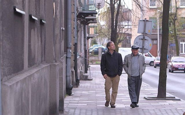 Jack Adler re-visiting his childhood home with his son Eli in Pabianice, Poland. (Michal Stainiak)