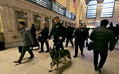Metro-North Railroad police officers with a police dog patrol at Grand Central Terminal, in New York, on March 22, 2016. (AP/Richard Drew, File)