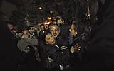 Relatives of people wounded in an explosion in Ankara, Turkey, react as they arrive at a hospital to see their loved ones, March 13, 2016. (Osmancan Gurdogan/Depo Photos via AP)