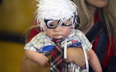 This Sunday, Feb. 14, 2016 file photo shows three-month-old Oliver Jack Carter Lomas-Davis, of Venice, Calif., dressed as Democratic presidential candidate Sen. Bernie Sanders, I-Vt., during a rally at Bonanza High School in Las Vegas. (AP Photo/Evan Vucci, File) This Sunday, Feb. 14, 2016 file photo shows three-month-old Oliver Jack Carter Lomas-Davis, of Venice, Calif., dressed as Democratic presidential candidate Sen. Bernie Sanders, I-Vt., during a rally at Bonanza High School in Las Vegas. (AP Photo/Evan Vucci, File)
