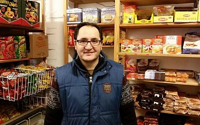Tehran native Kambiz Alizadeh at his Getränkemarkt Beethoven convenience store near the Roonstrasse synagogue in Cologne, Germany (Raphael Ahren/TOI)