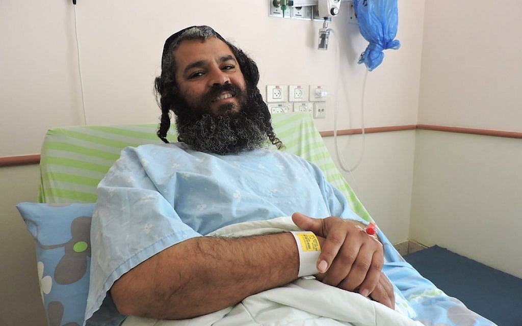 Yonatan Azriaev recovering from his wounds at a Petah Tikvah hospital, March 10, 2016. (Ben Sales, via JTA) Yonatan Azriaev recovering from his wounds at a Petah Tikvah hospital, March 10, 2016. (Ben Sales, via JTA)