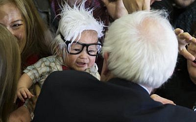 FILE - In this Sunday, Feb. 14, 2016 file photo, Democratic presidential candidate Sen. Bernie Sanders, I-Vt., right, meets Oliver Jack Carter Lomas-Davis, of Venice, Calif., who was dressed as Sanders during a rally at Bonanza High School in Las Vegas. (AP Photo/Evan Vucci, File)