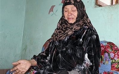 In this Feb. 16, 2016 photo, Um Muhammed speaks about the death of her son, Mohammed Hamdan, at the family house in Beni Suleiman village, south of Cairo, Egypt. (AP Photo/Maggie Michael)