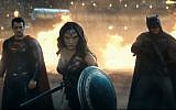Gal Gadot as Wonder Woman, flanked by Ben Affleck's Batman (right) and Henry Cavill's Superman (left). (YouTube screenshot)