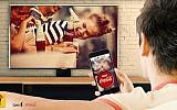 A Gett Coca Cola app user orders a soft drink from his smartphone, via Dov-e ultrasound technology (Courtesy)