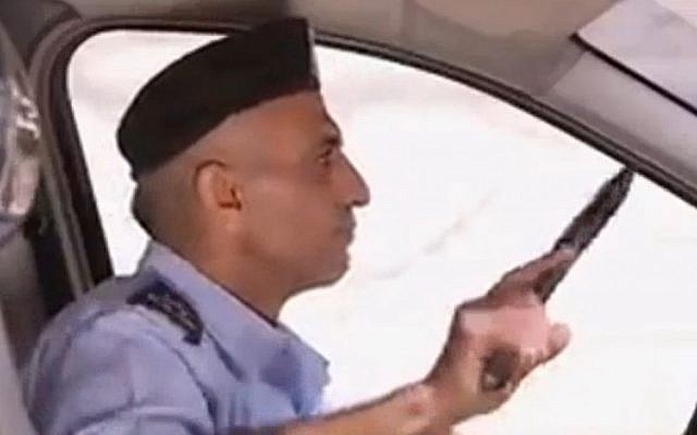 A Palestinian Authority policeman prepares to attack Israeli soldiers in a propaganda video produced by Hamas (Channel 10 news) A Palestinian Authority policeman prepares to attack Israeli soldiers in a propaganda video produced by Hamas (Channel 10 news)