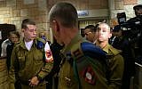 An IDF soldier who was filmed shooting a disarmed Palestinian assailant in the head arrives at a court hearing near Kiryat Malachi, March 29, 2016 (Flash90)