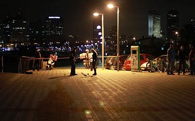 Security forces at the scene of a stabbing attack in which one person was killed and nine others were injured at the Jaffa Port on March 8, 2016. (Judah Ari Gross/Times of Israel)