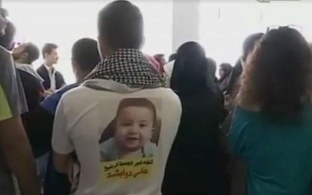 A supporter of the Dawabsha family outside Lod District Court on March 2, 2016. (Screen capture: Ramallah News) A supporter of the Dawabsha family outside Lod District Court on March 2, 2016. (Screen capture: Ramallah News)